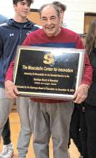 Gilbert ‘Gil’ Moscatello, vice president of the Board of Education, holds the sign that will be posted just outside the newly renamed Moscatello Center for Innovation at Valley Road School in Stanhope. (Photos by Kathy Shwiff)