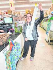 SH1 Cynthia Allen, president of the Rotary Club of Branchville, holds the register tape from the group’s shopping trip to Ocean State Job Lots in Sparta. They spent slightly less than $2,000 on items for the Sussex County Food Pantry. (Photo provided)