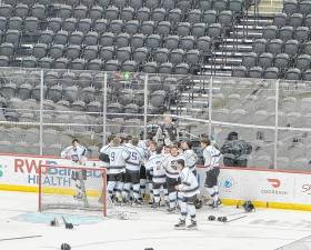 KJ1 The Kinnelon/Jefferson/Sparta ice hockey team celebrates its win in the NJSIAA Public Co-Op Tournament final Monday, March 10 at the Prudential Center in Newark. (Photo by Aidan Mastandrea)