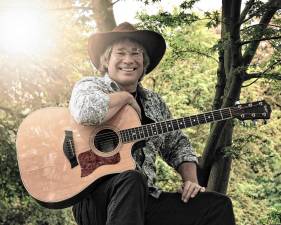 <b>Ted Vigil portrays the legendary singer-songwriter in ‘</b>A John Denver Christmas’ on Saturday night at the Newton Theatre. (Photo courtesy of Ted Vigil)