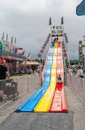 <b>Logan Deguarde comes down the slide at the fair. (Photo by Nancy Madacsi)</b>