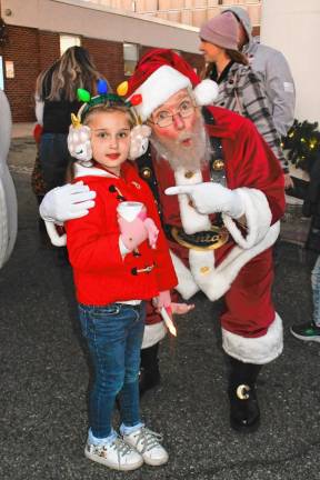 FT2 Olivia Kopala of Newton poses with Santa.