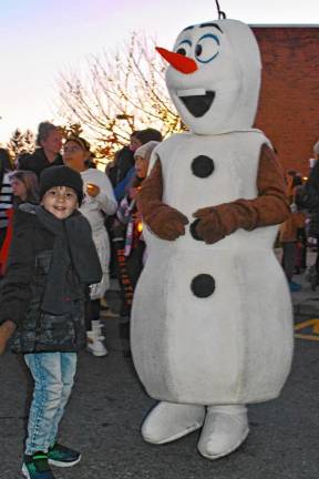 Mario Giovane of Newton poses with Olaf, a character in the movie ‘Frozen.’