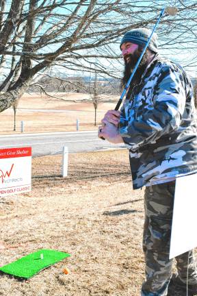 <b>Dave Whisner Jr. takes his shot in the Chili Open Golf Classic, which benefits a Project Self-Sufficiency initiative to help Sussex County residents who need emergency temporary shelter or stable housing. (Photos by Maria Kovic)</b>