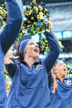 Marissa Marston, Pope John senior cheerleader, cheers on the Lions during the second half.