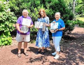 Teresa Zinck, left, and Rose Wolverton, right, of the Snufftown Garden Club hold Silver Awards from the Garden Club of New Jersey. With them is Beverly Kazickas, president of the Garden Club of New Jersey. (Photo provided)