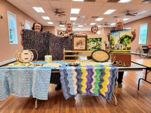 <b>Tranquility United Methodist Church members, from left, Barbara Morgan, Kevin Conn, and Charlene and Rich Gardiner with items to be sold in the Lord’s Auction on Saturday, Aug. 31. (Photo provided)</b>