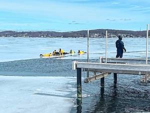 First-responders rescue a man who fell through the ice on Lake Hopatcong on Wednesday, Feb. 19. They had been taking part in an ice rescue training exercise when they heard about the emergency. (Photos provided)