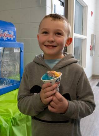 Logan Enzo with a multicolored snowcone.