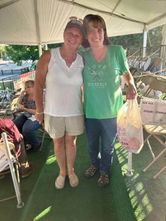 Jenny Shotwell, left, and Sue Marshall, secretary of the committee, stand among the temporary box seats.