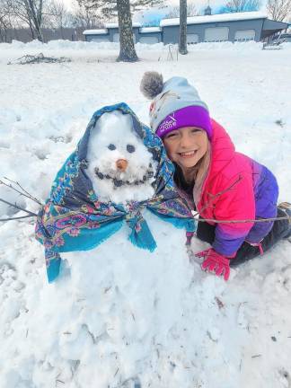 <b>Jackie Gunther, 9, with a snowwoman Friday, Nov. 22 in Wantage. (Photo courtesy of Rebecca Gunther)</b>