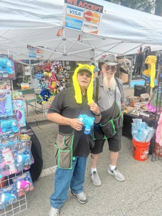 At right is Henry Gardner of New England Novelty. He has had a booth at Newton Day for the past 14 years. (Photo by Aidan Mastandrea)