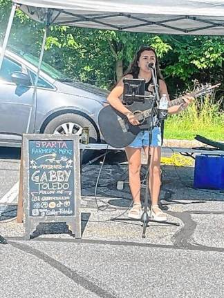 <b>Gabby Toledo plays Saturday morning at the Sparta Farmers Market. (Photo by Stefani M.C. Janelli)</b>