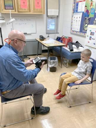 The West Milford Lions Club uses a Welch/Allyn Vision Screener to test children’s eyesight.