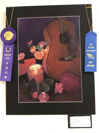 Elizabeth Coyle, a sophomore at Mount Olive High School, won the high school Best In Show Award for ‘Melodies in Bloom’ at the art show April 26 at Wallkill Valley Regional High School.