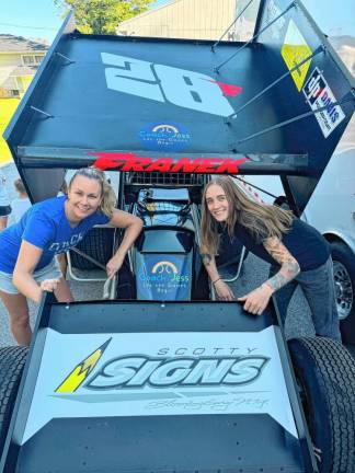 <b>Jessica Lain Magura, left, and Kelsey Lynn Stoll in front of Davie Franek’s sprint car.</b>