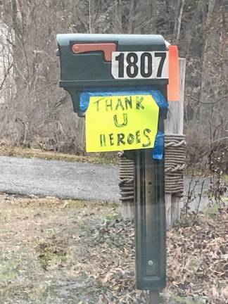 WF6 A sign taped to a mailbox thanks first-responders fighting the Jennings Creek Wildfire in Greenwood Lake, N.Y. (Photo by Kathy Shwiff)