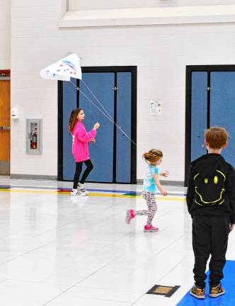 McKenna Reid flies a kite.