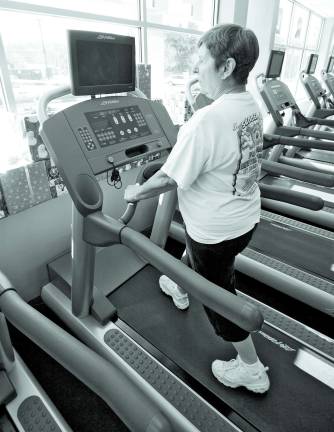 Stanhope resident Debbie Solowey walks on one of the many treadmills at RDA Fitness.