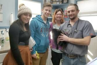 Julia Ragno, Krystian Kipp and Jodi White, and Scott Gaydos pose with Jilly-May.