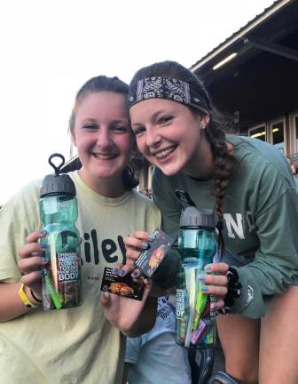 Kate King, left, now a senior at High Point Regional High School, attends a Sussex County Miners game with her friends when she was younger. (Photo provided)