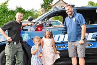 CC1 From left are Derek Kuncken, president of Byram Township PBA Local 406; Abigail and Eva Sarna; and Officer Christopher Spaldo at the Cones with a Cop event Thursday, July 18. (Photos by Maria Kovic)