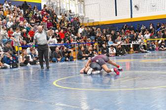 <b>Amanda Scarpati of Lakeland Regional High School and Kameko Sibblies of Newton/Kittatinny compete in the 109-pound weight class in the NJSIAA North Jersey, Section 1, District/Region championships Sunday, Feb. 23 at Vernon Township High School. (Photo by Maria Kovic)</b>