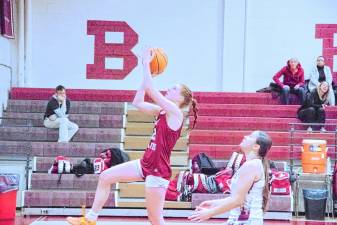 Newton's Avery Eigner leaps during a shot in the game against Leonia on Feb. 27. The Braves lost, 51-40, in the first round of the NJSIAA North Jersey, Section 1, Group 2 tournament. Eigner scored eight points and grabbed 12 rebounds. (Photos by George Leroy Hunter)