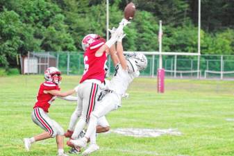 <b>High Point defensive back Dylan Masters gets a hand on the ball, deflecting it from Wallkill Valley receiver Connor Hoebee in the first half of their game Aug. 29. (Photos by George Leroy Hunter)</b>