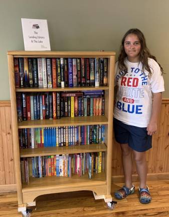 Haley Morodan refurbished an old bookshelf and added wheels, then filled it with books for all ages that were collected from the community.