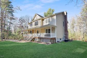 Farmhouse-style four-bedroom home has lake access