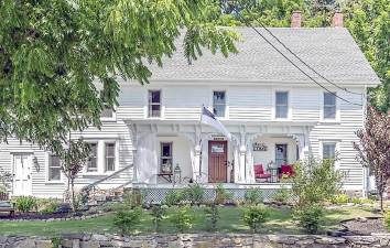 Old world charm abounds in this updated farmhouse