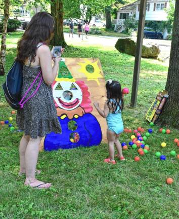 A girl tries the clown toss.