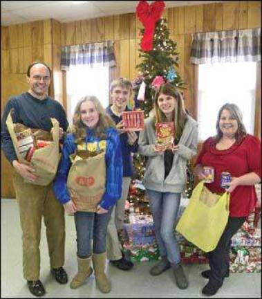 Christmas dinner, caroling and donations at Sussex UMC