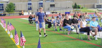 Students walk forward to be recognized. (Photo by Vera Olinski)