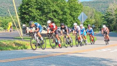 Seven cyclists lead in the Men 123 category of the Giro del Cielo Road Race on Sunday morning, July 14 in Branchville. In that category, for the fastest riders, the cyclists were repeating the 8.8-mile loop course seven times for a total of about 57 miles. (Photos by Kathy Shwiff)