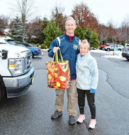 Sean and Sue Mayer of Lafayette drop off food donations.