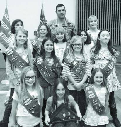 Photo Provided Members of Girl Scout Troop 1070 are seen with US Army Sgt. Victor Alves.