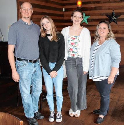 From left, Drew Daly with his daughter Katya and Brenna Loven with her mother, Heather.