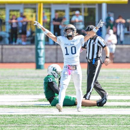 <b>Pope John’s Alex Rakowsky celebrates after breaking up a pass reception by Delbarton’s Girard Yoo in the first quarter. (Photo by Glenn Clark)</b>