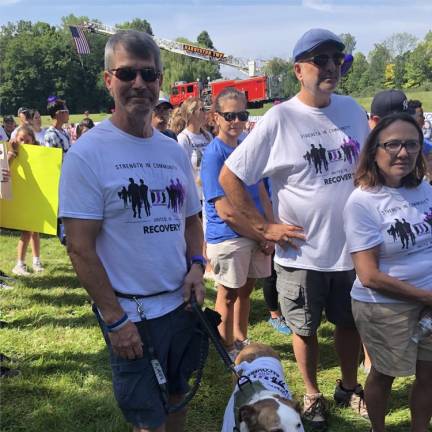 The four-legged participant also wears a T-shirt for the event.