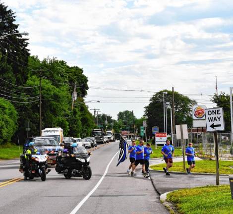 Participants in the Law Enforcement Torch Run for Special Olympics New Jersey have a motorcycle escort Friday morning, June 7 in Franklin. (Photo by Maria Kovic)