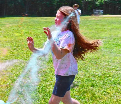 A girl is sprayed with color in the Color Run on Sunday, June 2 at Byram School. It was sponsored by the Byram PTA. (Photos by Maria Kovic)