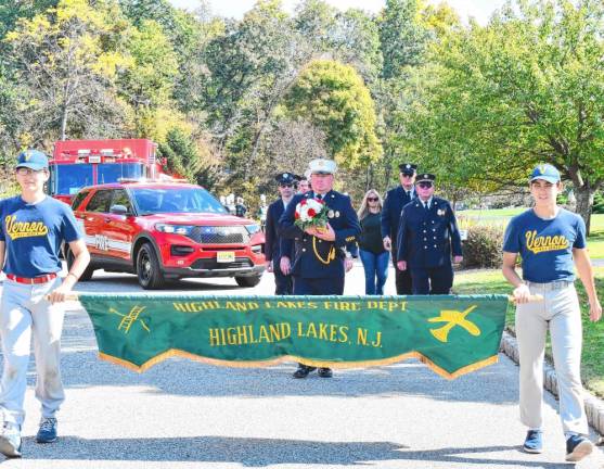 Members of the Highland Lakes Fire Department march in the parade.