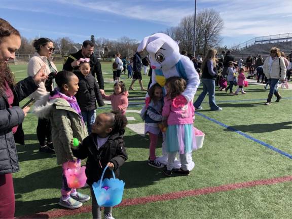 The Easter Bunny offers hugs after the hunt.