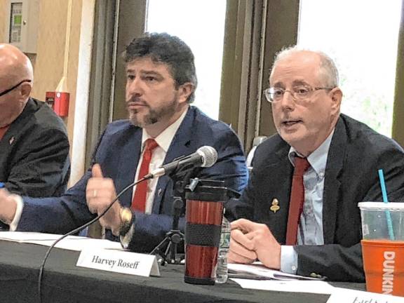 Harvey Roseff, right, answers a question at the candidates forum. He is running on a slate with Robert Kovic, left.