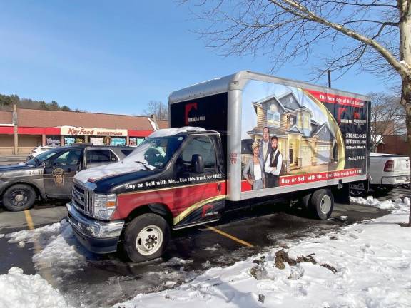 The state police investigate the truck vandalism in the Key Food parking lot. (Photo provided by Lisa McAteer)