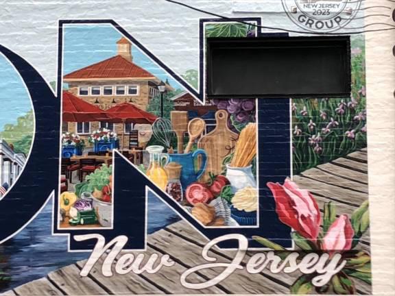 The mural contains depictions of sites in Newton, such as Hayek’s Market.