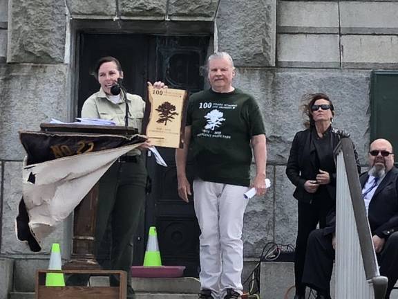 Robert Oleksy, president of the Friends of High Point State Park, presented a plaque to Rebecca Fitzgerald, an administrator with the New Jersey State Park Service who has worked at the park for 24 years. At right are Patricia Green and Richard Periu, past exalted ruler and exalted ruler, respectively, of Sussex Elks Lodge 2288.