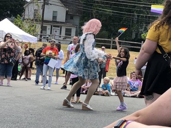 A drag performer known as Fantasia dances with girls in the crowd.